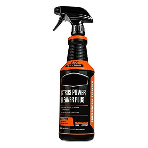 Carisma™ Power Clean citrus cleaning solution in a spray bottle, with a focus on the vibrant citrus label and spray nozzle.